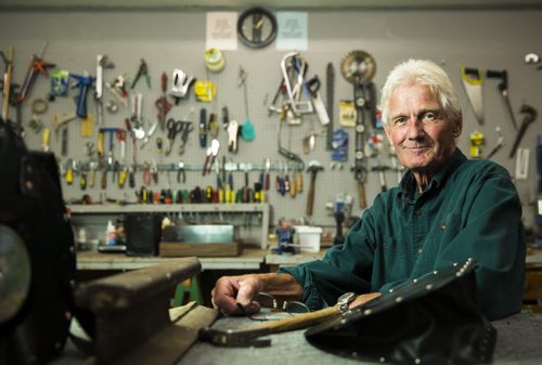 Alf Dick, volunteer at the MCC thrift store, makes purses out of old vinyl records in Winnipeg on Tuesday, July 28, 2015.  Mikaela MacKenzie / Winnipeg Free Press