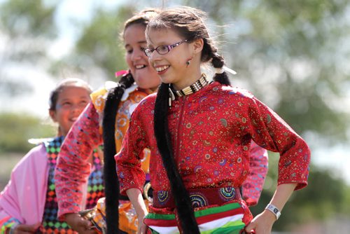 Twelve-year-old Jungle Dancer, Angel Best is all smiles as she  plays musical chairs with fellow dancers during the Gilbert Park Community Pow Wow Tuesday presented by Gilbert Park Going Places Culture Club.   July 28,, 2015 Ruth Bonneville / Winnipeg Free Press