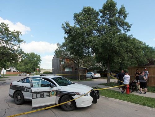 Police Cruisers block off a lane at Taft Cresc at Nassau Tuesday afternoon after a shooting sent one man to hospital. See  story. July 28, 2015 - (Phil Hossack / Winnipeg Free Press)