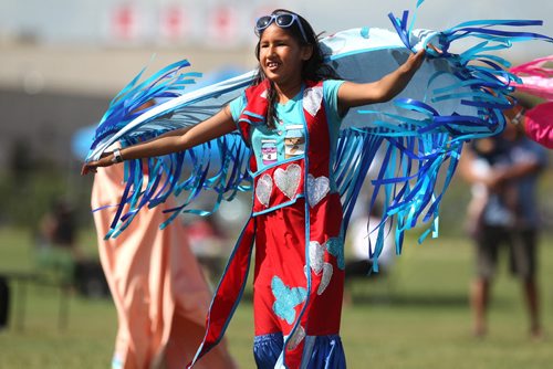 Twelve-year-old Fancy Shawl Dancer, Precious Harper, spreads her shawl out in the wind while dancing with fellow dancers during the Gilbert Park Community Pow Wow Tuesday presented by Gilbert Park Going Places Culture Club.   July 28,, 2015 Ruth Bonneville / Winnipeg Free Press