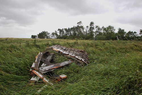 A wishing well lies destroyed from the tornado in a ditch along Hwy 256 close to Tilston, MB.  150728 July 28, 2015 MIKE DEAL / WINNIPEG FREE PRESS