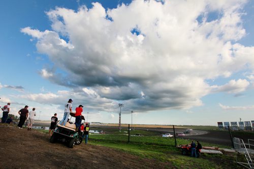 Pit Crews scan the action from one side of the grandstand hill at Red River Speedway's Monday night races. See  story. July 27, 2015 - (Phil Hossack / Winnipeg Free Press)