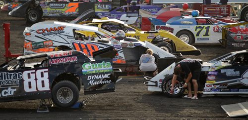 The pit full of cars and crews working towards a win at Red River Speedway's Monday night races. See  story. July 27, 2015 - (Phil Hossack / Winnipeg Free Press)