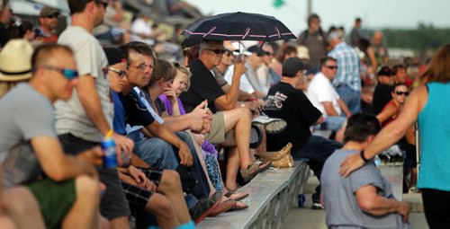 Spectators fill the bleachers to watch race cars careen around a dirt track at Red River Speedway's Monday night races. See  story. July 27, 2015 - (Phil Hossack / Winnipeg Free Press)
