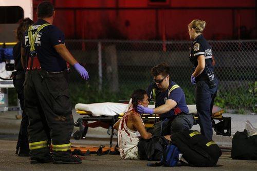 July 28, 2015 - 150728  -  A pedestrian hit by an east bound car is attended to on Selkirk Avenue Tuesday, July 28, 2015. John Woods / Winnipeg Free Press