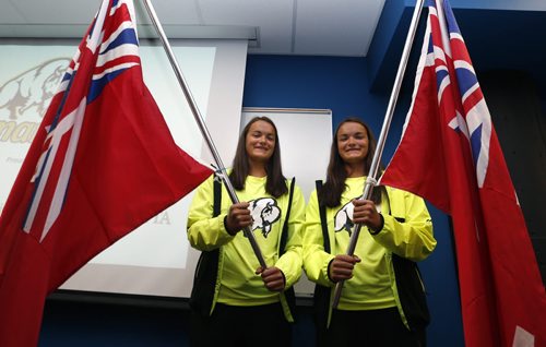 Twin sisters Josie,right, and Kearley Abbott who have been selected as Team Manitoba's flag bearers to kick off the 2015 Western Canada Summer games in Wood Buffalo, Alberta Aug, 7- August 16. The twins are on the Beach Volleyball team and are wearing the new Team Manitoba uniform. Scott Billeck storyWayne Glowacki / Winnipeg Free Press July 29 2015 ¤