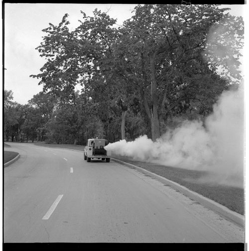 A fogging machine makes it's way along Assiniboine Park Drive. July 12, 1968 Jack Ablett / Winnipeg Free Press fparchives