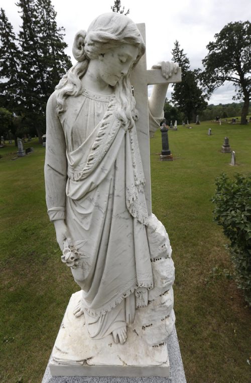 Margaret Laurence's famous Stone Angel that is part of the headstone in the Riverside Cemetery in Neepawa, Mb. of the Hon.John Andrew Davidson who died in 1903 and his wife Sophia who died in 1913. Bill Redekop story. Wayne Glowacki / Winnipeg Free Press July 28 2015