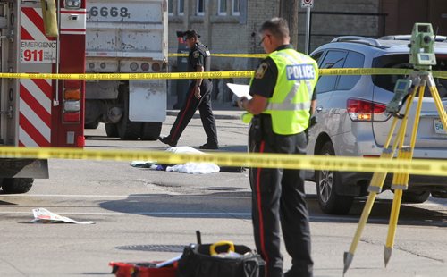 A female pedestrian died during this mornings rush hour as she crossed King St. at Logan Ave. when a large truck drove over her. Winnipeg police and emergency investigators are on the scene keeping Logan and King closed to traffic for the foreseeable future.  150730 July 30, 2015 MIKE DEAL / WINNIPEG FREE PRESS