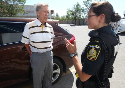 Robert Kury blew aa ir horn as MP Joyce Bateman,  Minister Drew Caldwell, and Mayor  Brian Bowman  announcing funding for a new underpass at Taylor and Waverley- He believes the expanded lanes will cause heavy traffic to pour into River Heights Police arrived a few minutes later and asked the man calm and move on to move on-See Aldo Santin- July 29, 2015   (JOE BRYKSA / WINNIPEG FREE PRESS)