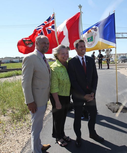 L to R- Minister Drew Caldwell , MP Joyce Bateman, and Mayor  Brian Bowman  announced funding for a new underpass at Taylor and Waverley in Winnipeg Thursday- -See Aldo Santin story - July 29, 2015   (JOE BRYKSA / WINNIPEG FREE PRESS)