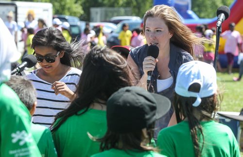 Singer Micaylee Rodyniuk, 20, with the Jazz on Wheels band performs for kids at the Sinclair Park Community Centre Thursday afternoon. Jazz on Wheels is a mobile jazz presentation conceived and directed by Steve Kirby from the University of Manitoba and produced by Jazz Winnipeg. 150730 - Thursday, July 30, 2015 -  MIKE DEAL / WINNIPEG FREE PRESS