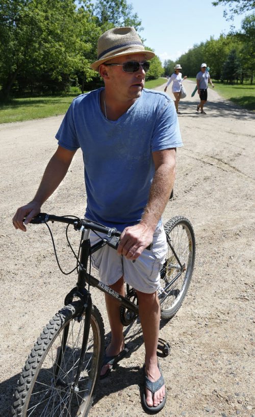 Eric Nichols on his bike at Victoria Beach. For story about rules limiting vehicles in the Victoria Beach community.  Alex Paul  story Wayne Glowacki / Winnipeg Free Press July 30 2015
