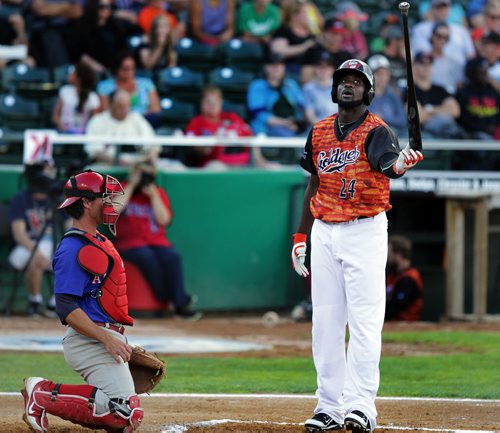 Winnipeg Goldeye Reggie Abercrombie tosses his bat as Amarillo Thunderhead catcher Cory Bass watches. After swinging a strike Thursday at Shaw Park Reggie went on to strike out in the top of the 2nd. July 30, 2015 - (Phil Hossack / Winnipeg Free Press)