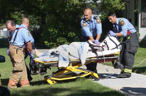 EMS  and Fire Crews  to compressions to tend to a person who was reportedly shot in the 600 Block of Moncton Ave  No other details available at this time-Breaking News- July 31, 2015   (JOE BRYKSA / WINNIPEG FREE PRESS)