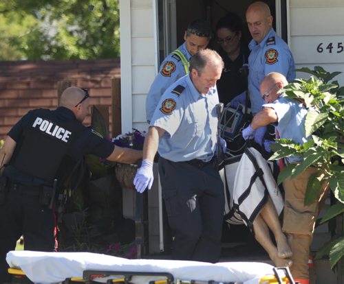 EMS  and Fire Crews tend to a person who was reportedly shot in the 600 Block of Moncton Ave  No other details available at this time-Breaking News- July 31, 2015   (JOE BRYKSA / WINNIPEG FREE PRESS)