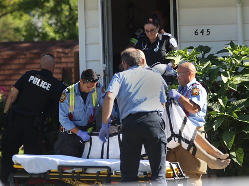 EMS  and Fire Crews tend to a person who was reportedly shot in the 600 Block of Moncton Ave  No other details available at this time-Breaking News- July 31, 2015   (JOE BRYKSA / WINNIPEG FREE PRESS)