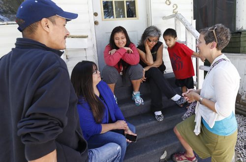 At right, Jessica Woolford, the woman who started a GoFundMe campaign presented Rinelle Harper, seated with her arms crossed and her family a cheque for $200 Friday, the amount is the result of people just directly handing Jessica cash.   Sexual assault survivor Rinelle is with her father Caesar from left,  Julie, mother, grandmother Carol and cousin Eli, the online campaign has already exceeded the $13,000 target for the family that lost their reserve home in a suspected arson and had no way of paying the rent for their Winnipeg home.  Gord Sinclair story Wayne Glowacki / Winnipeg Free Press July 31 2015