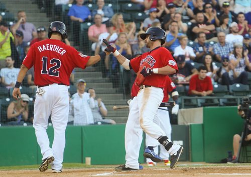 Winnipeg Goldeye Josh Mazzola (right) high-fives Casey Haerther after coming home in a game versus the Amarillo Thundercats at Shaw Park in Winnipeg on Friday, July 31, 2015.  Mikaela MacKenzie / Winnipeg Free Press