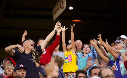 Young and old alike reach for a ball at the Winnipeg Goldeyes game versus the Amarillo Thundercats at Shaw Park in Winnipeg on Friday, July 31, 2015.  Mikaela MacKenzie / Winnipeg Free Press