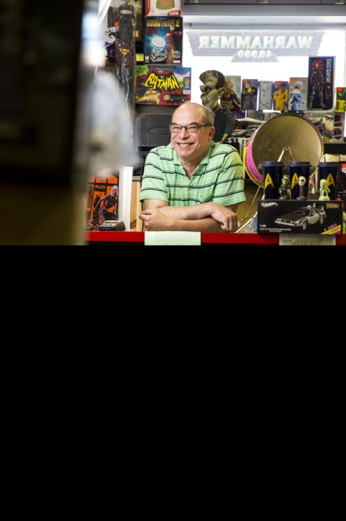 Joe Krolik, owner of Comics America, poses in his store filled with comics and pop culture stuff dating back to the early 1900s in Winnipeg on Saturday, Aug. 1, 2015.  Mikaela MacKenzie / Winnipeg Free Press