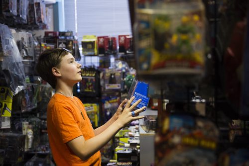 Riley Wilcosh, 11, looks through the stuff at Comics America in Winnipeg on Saturday, Aug. 1, 2015.  Mikaela MacKenzie / Winnipeg Free Press