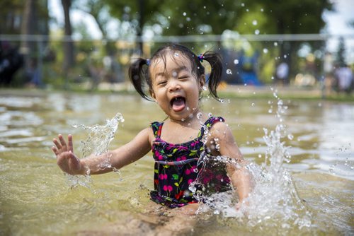 Emily Tran, 2, plays in a wading pool in Winnipeg on Saturday, Aug. 1, 2015.  Mikaela MacKenzie / Winnipeg Free Press