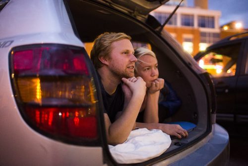 Brad (left) and Andy Leitch watch Back to the Future 2 at a pop-up drive-in movie theatre in downtown Winnipeg on Saturday, Aug. 1, 2015.  Mikaela MacKenzie / Winnipeg Free Press