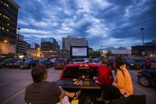The Wasylenchuk family watches Back to the Future 2 from the back of their pick-up truck at a pop-up drive-in movie theatre in downtown Winnipeg on Saturday, Aug. 1, 2015.  Mikaela MacKenzie / Winnipeg Free Press
