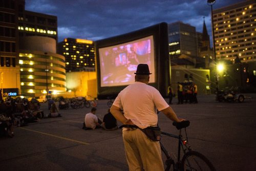 People watch Back to the Future 2 at a pop-up drive-in movie theatre in downtown Winnipeg on Saturday, Aug. 1, 2015.  Mikaela MacKenzie / Winnipeg Free Press