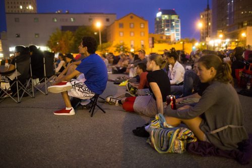 People watch Back to the Future 2 at a pop-up drive-in movie theatre in downtown Winnipeg on Saturday, Aug. 1, 2015.  Mikaela MacKenzie / Winnipeg Free Press