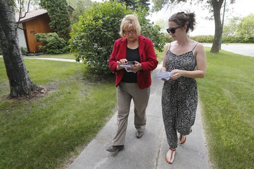August 3, 2015 - 150803  -  MaryAnn Mihychuk, Liberal federal candidate for Kildonan-St. Paul, walks with Gillian Hanson, campaign manager, as she checks poling numbers as they door knock in her riding Monday, August 3, 2015. John Woods / Winnipeg Free Press