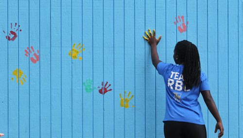 Raissa Uwizeye with the RBC career launch program works with the Boys and Girls Club and Take Pride Winnipeg!s Green Wave program to give the Aberdeen Community Centre a facelift.  150804 August 04, 2015 MIKE DEAL / WINNIPEG FREE PRESS