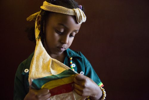 Hilina Yosef, 5, waits for visitors at the Ethiopian Folklorama pavilion in Winnipeg on Tuesday, Aug. 4, 2015.  Mikaela MacKenzie / Winnipeg Free Press