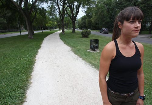 33 yr old Amory Steek tells her tale of two bizarre incidents this week where a man drops his wallet on Wellington Cres. She tells tale on the spot on Wellington where incidents occurred-See  Katie May  story- Aug 05, 2015   (JOE BRYKSA / WINNIPEG FREE PRESS)