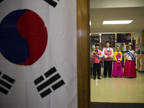 People dressed in traditional costumes welcome visitors to the Korean pavilion of Folklorama in Winnipeg on Wednesday, Aug. 5, 2015.  Mikaela MacKenzie / Winnipeg Free Press
