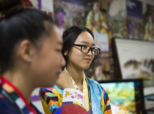 Lucia Kim welcomes visitors in traditional dress at the Korean pavilion of Folklorama in Winnipeg on Wednesday, Aug. 5, 2015.  Mikaela MacKenzie / Winnipeg Free Press
