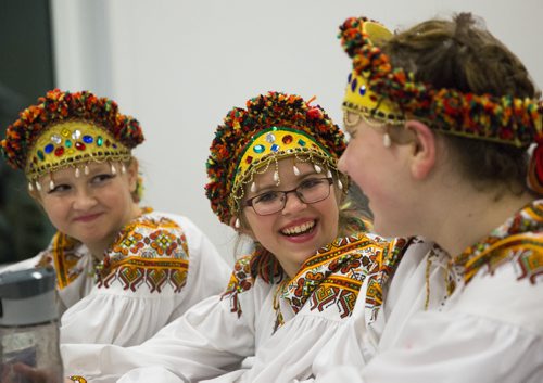 Khrissy (left), Victoria, and Yelena giggle before performing at the Ukrainian pavilion of Folklorama in Winnipeg on Wednesday, Aug. 5, 2015.  Mikaela MacKenzie / Winnipeg Free Press