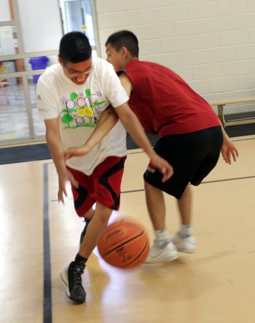 Carter Goosehead(left) scrimmages THursday afternoon. He's the organizer of the Dufferin Youth basketball initiative and is helping organize a group of Dufferin neighbourhood youth who have organized several tournaments this summer. This photo is for Melissas sports Saturday Special. August 6, 2015 - (Phil Hossack / Winnipeg Free Press)
