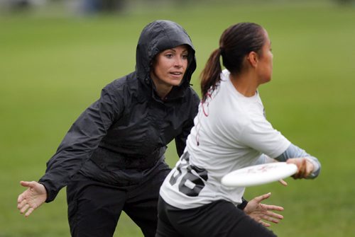 Leah Parker (left) of the Women's Senior Ultimate team "Fusion" works out in a drizzle THursday at Assinaboine Park. See Scott B's story. August 6, 2015 - (Phil Hossack / Winnipeg Free Press)
