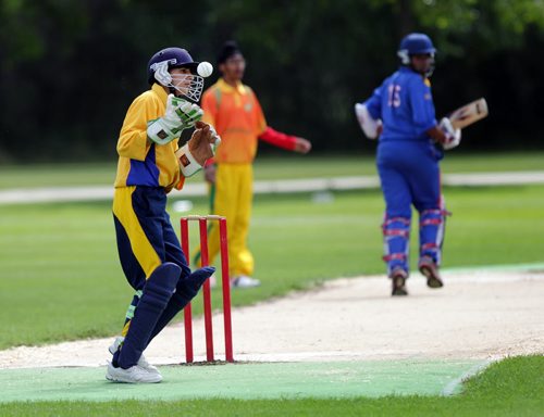 Manitoba wicket keeper Shiv Moaghil (in helmet) catches the throw to stop team BC's point scoring runFriday afternoon in the final day of the Cricket Canada U-16 Championships.  See Tim Campbell's story. August 7, 2015 - (Phil Hossack / Winnipeg Free Press)