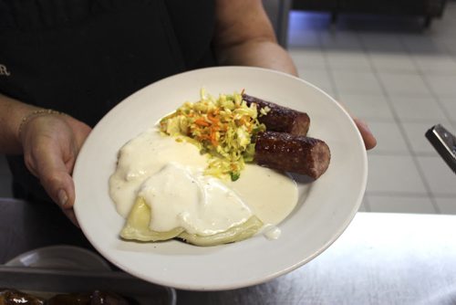 Plate of traditional Mennonite lunch: farmer sausage, vereniki, and cole slaw. BILL REDEKOP/WINNIPEG FREE PRESS July 31,  2015