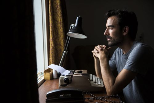 Lyndon Froese, who went an entire month without using anything with screens, is pictured with his typewriter and retro phone in his home  office in Winnipeg on Friday, Aug. 7, 2015.    Mikaela MacKenzie / Winnipeg Free Press