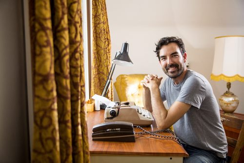 Lyndon Froese, who went an entire month without using anything with screens, is pictured with his typewriter and retro phone in his home  office in Winnipeg on Friday, Aug. 7, 2015.    Mikaela MacKenzie / Winnipeg Free Press