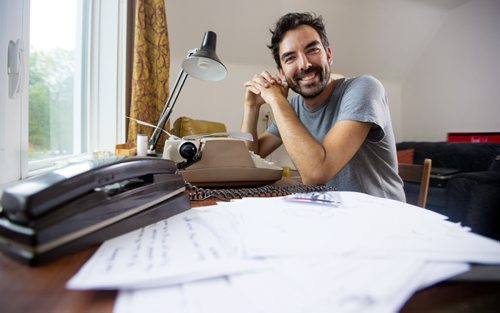 Lyndon Froese, who went an entire month without using anything with screens, is pictured with his typewriter, retro phone, and many faxes and handwritten letters in his home  office in Winnipeg on Friday, Aug. 7, 2015.    Mikaela MacKenzie / Winnipeg Free Press