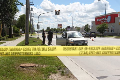 Police Officers investigate a pedestrian  accident involving an older woman crossing at a cross walk on St. Annes Rd. at Compark Saturday afternoon.  No other information available at this time.   Aug 8, 2015 Ruth Bonneville / Winnipeg Free Press