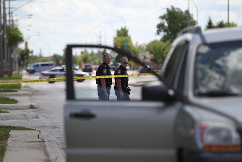 Police Officers investigate a pedestrian  accident involving an older woman crossing at a cross walk on St. Annes Rd. at Compark Saturday afternoon.  Vehicle in photo was involved in accident. No other information available at this time.   Aug 8, 2015 Ruth Bonneville / Winnipeg Free Press