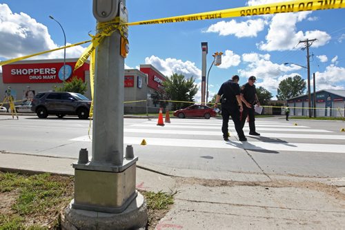 Police Officers investigate a pedestrian  accident involving an older woman crossing at a cross walk on St. Annes Rd. at Compark Saturday afternoon.   Aug 8, 2015 Ruth Bonneville / Winnipeg Free Press