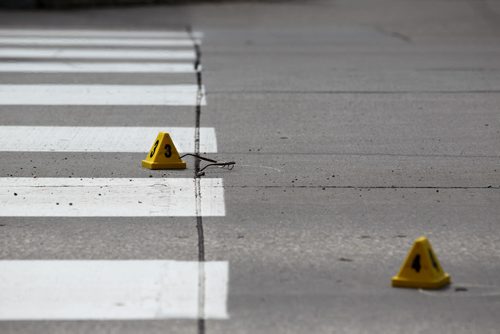 Police Officers investigate a pedestrian  accident involving an older woman crossing at a cross walk on St. Annes Rd. at Compark Saturday afternoon.   A pair of glasses belonging to the pedestrian sit near the crosswalk besidet a police marker.   Aug 8, 2015 Ruth Bonneville / Winnipeg Free Press