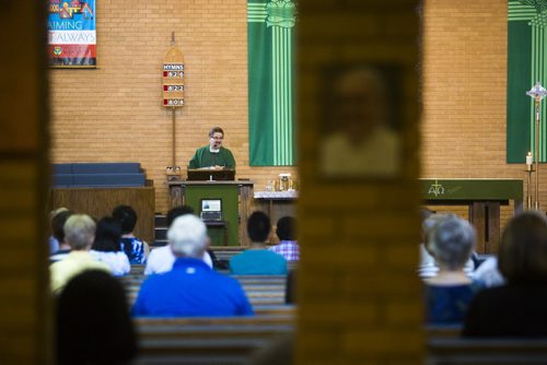 Reverend Rob Polz leads mass at St. John XXIII Church in Winnipeg on Saturday, Aug. 8, 2015.  Many faith groups are urging parishioners to vote and issuing election guides on issues. Mikaela MacKenzie / Winnipeg Free Press